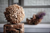 a wooden stand with a sculpture of a plant at Micasa Hotel in Taichung