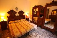 A bed or beds in a room at villatiffany