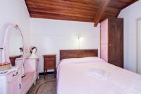 A bed or beds in a room at villatiffany