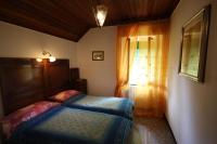 A bed or beds in a room at villatiffany