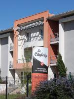 a building with a sign in front of it at City Lodge Appart Hôtel Niort in Niort