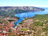 an aerial view of a town next to a lake at Apartman Lorena in Stari Grad