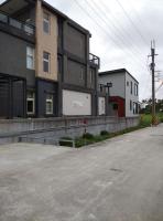 an empty street in front of a building at 水和風民宿 in Dongshan