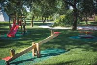 a park with a playground with a slide at L&#39;Escale des Châteaux de la Loire in Angé
