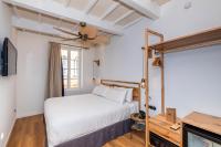 Posteľ alebo postele v izbe v ubytovaní Nao Catedral Boutique Hotel