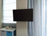 Televízia a/alebo spoločenská miestnosť v ubytovaní Ntelis Home