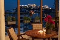 A balcony or terrace at Mosaics Astonishing Acropolis view Aprtm