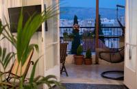 A balcony or terrace at Mosaics Astonishing Acropolis view Aprtm