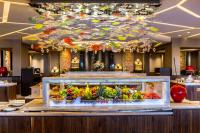 a buffet in a hotel with a display of vegetables at Four Seasons Hotel in Limassol
