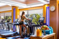 a woman on a treadmill in a gym at Four Seasons Hotel in Limassol