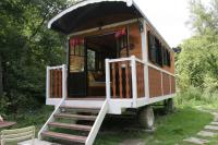a tiny house on wheels with the door open at La Maison de l&#39;Omignon in Vermand
