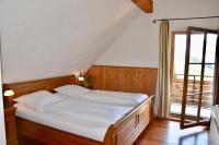 Postel nebo postele na pokoji v ubytování Hotel & Chalets Herrihof
