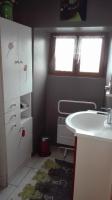 a bathroom with a white sink and a window at Gite de charme au coeur de la Bourgogne in Santigny