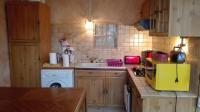 a small kitchen with a sink and a yellow microwave at Gite de charme au coeur de la Bourgogne in Santigny