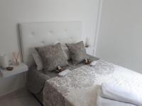 Postel nebo postele na pokoji v ubytování Appartement avec Solarium