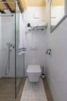 a bathroom with a toilet and a glass shower stall at House Nono in Poreč