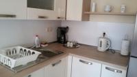 Kuchyňa alebo kuchynka v ubytovaní Apartman Viktorija