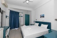A bed or beds in a room at Kallithea Studios