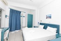 A bed or beds in a room at Kallithea Studios