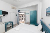 A bed or beds in a room at Kallithea Studios