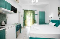 A bed or beds in a room at Kallithea Studios