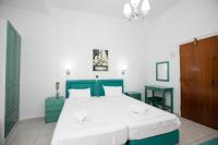 A bed or beds in a room at Kallithea Studios