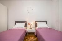 Postel nebo postele na pokoji v ubytování Apartman Šesna
