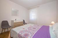 Postel nebo postele na pokoji v ubytování Apartman Šesna