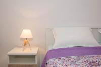 Postel nebo postele na pokoji v ubytování Apartman Šesna