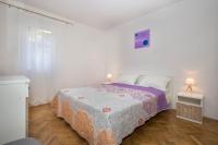 Postel nebo postele na pokoji v ubytování Apartman Šesna