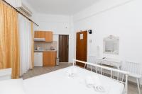 A kitchen or kitchenette at Kallithea Studios