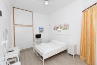 A bed or beds in a room at Kallithea Studios