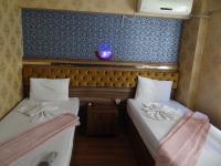 Postel nebo postele na pokoji v ubytování Meta Hotel