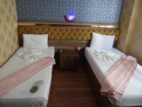 Postel nebo postele na pokoji v ubytování Meta Hotel
