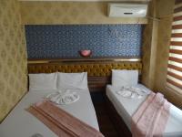 Postel nebo postele na pokoji v ubytování Meta Hotel