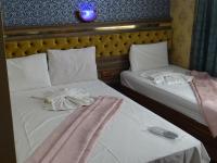 Postel nebo postele na pokoji v ubytování Meta Hotel