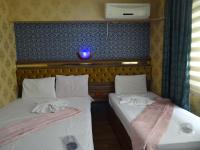 Postel nebo postele na pokoji v ubytování Meta Hotel
