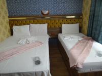 Postel nebo postele na pokoji v ubytování Meta Hotel