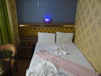 Postel nebo postele na pokoji v ubytování Meta Hotel