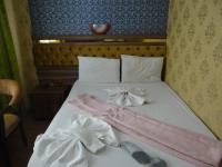 Postel nebo postele na pokoji v ubytování Meta Hotel