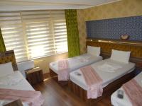 Postel nebo postele na pokoji v ubytování Meta Hotel