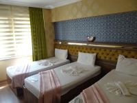 Postel nebo postele na pokoji v ubytování Meta Hotel