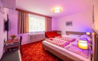 Posteľ alebo postele v izbe v ubytovaní Guesthouse Cyprian
