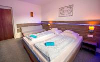 Posteľ alebo postele v izbe v ubytovaní Guesthouse Cyprian
