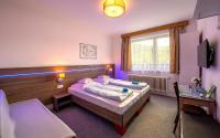 Posteľ alebo postele v izbe v ubytovaní Guesthouse Cyprian