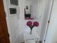Telewizja i/lub zestaw kina domowego w obiekcie Rosamar Luxury Apartment