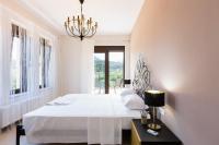 Posteľ alebo postele v izbe v ubytovaní Eudora Luxury Stone Villa