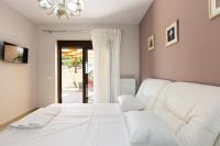 Posteľ alebo postele v izbe v ubytovaní Eudora Luxury Stone Villa