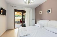 Posteľ alebo postele v izbe v ubytovaní Eudora Luxury Stone Villa