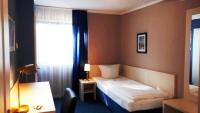 Postel nebo postele na pokoji v ubytování Hotel Pelikan